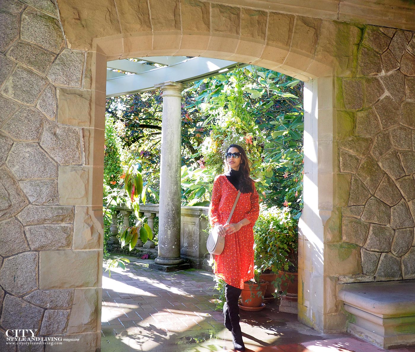 City style and living magazine Editors Notebook style fashion blogger Shivana M Hatley Castle and Gardens rose and floral dress with knee high black boots Italian gardens stone wall