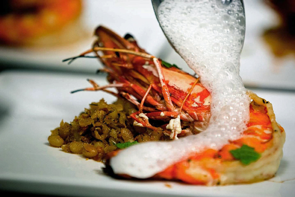 A prawn dish gets a final touch at Venue restaurant in Lincoln.